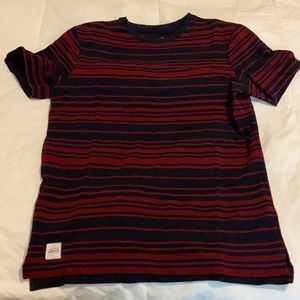 Striped shirt with black and maroon stripes.